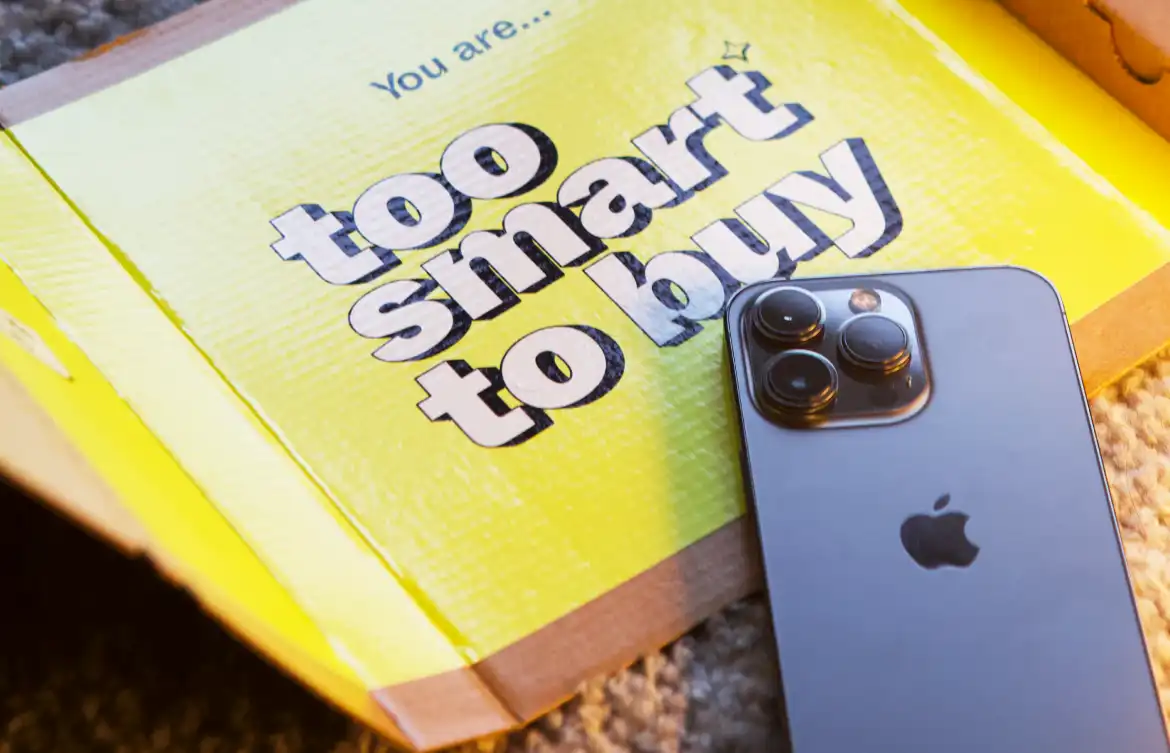 Picture of an iPhone and a a card saying too smart to buy